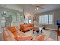 Open living room featuring bright colors, a ceiling fan, and a view of the kitchen at 359 Muirfield Pkwy, Charleston, SC 29414