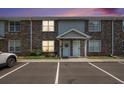 Brick two-story townhouse featuring a well-manicured lawn and convenient parking at sunset at 506 Arlington Dr # F, Charleston, SC 29414