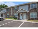 Brick two-story townhouse featuring a well-manicured lawn and convenient parking at 506 Arlington Dr # F, Charleston, SC 29414