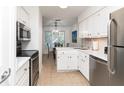 Bright kitchen featuring white cabinetry and stainless steel appliances at 5504 Green Dolphin Way, Kiawah Island, SC 29455