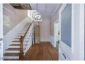 Spacious foyer with hardwood floors and staircase leading to the upper level at 634 Rutledge Ave, Charleston, SC 29403