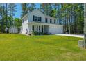 Two story home with a large yard, shed, and beautiful landscaping at 689 W Butternut Rd, Summerville, SC 29483
