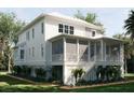 Inviting home features a screened-in porch, offering a relaxing outdoor space with scenic views at 8266 Jack Island Dr, Johns Island, SC 29455