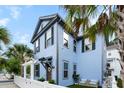 Beautiful blue home featuring a cozy outdoor seating area and a white picket fence, perfect for enjoying the outdoors at 8604 Bowen Corner Ave, Hanahan, SC 29410