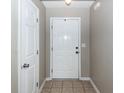 Clean entryway with a neutral wall color, ceramic tile flooring, and a white front door at 102 Jasimine Ct, Summerville, SC 29486