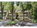 Inviting exterior of a condo with mature trees and green space, offering a serene and picturesque setting at 1195 Village Creek Ln # 2, Mount Pleasant, SC 29464