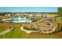 Aerial view of the community playground and pool amenities offering leisure and recreation at 136 Yarrow Way, Moncks Corner, SC 29461