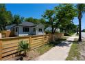 Charming home with a wood fence and sidewalk at 1430 E Montague Ave, North Charleston, SC 29405