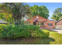 Inviting home with mature landscaping and solar panels on roof at 1593 Westwood Dr, Charleston, SC 29412