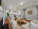 Open-concept living area showcasing wood floors, stylish furnishings, and easy access to the kitchen at 214 Center Hill Ct, Summerville, SC 29485
