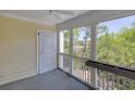 Enclosed porch features an exterior door, and windows with views of the marsh and maritime forest at 2333 Tall Sail Dr # G 607, Charleston, SC 29414