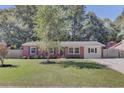 Charming single-story brick home with a well-manicured front lawn and landscaping at 25 Aldene Ave, Goose Creek, SC 29445