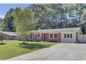 Charming single-story brick home with a well-manicured lawn and a long driveway at 25 Aldene Ave, Goose Creek, SC 29445