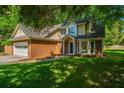Beautiful two-story brick home with a bay window, attached garage, and lush green lawn at 2650 Summer Leaves Ct, Charleston, SC 29414