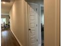 Hallway features wood floors and access to bedroom at 305 Camellia Bloom Dr, Moncks Corner, SC 29461