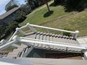 Exterior stairs with white railings and cable detail at 305 Matilda St, Edisto Beach, SC 29438