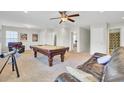 Spacious game room with a pool table, comfortable seating, and a ceiling fan at 308 Legendres Dr, Goose Creek, SC 29445
