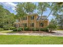 Traditional two-story brick home with black shutters and inviting curb appeal at 3331 Cottonfield Dr, Mount Pleasant, SC 29466