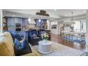 Open-concept living area featuring custom cabinets, a dining area, and a natural light at 408 N Palmetto St, Summerville, SC 29483