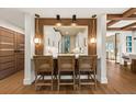 Modern kitchen featuring a breakfast bar with seating, pendant lights, and view to the kitchen at 4943 Green Dolphin Way, Kiawah Island, SC 29455