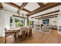 Open concept living and dining area with exposed wood beams and bright, airy design at 4943 Green Dolphin Way, Kiawah Island, SC 29455