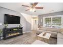 Cozy living room with a fireplace, neutral colors, and stylish flooring at 4987 Ballantine Dr, Summerville, SC 29485