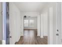 Bright foyer with hardwood floors leading to an open living space, enhancing the home's appeal at 5040 Thornton Dr, Summerville, SC 29485