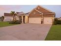 Attractive brick home with a two-car garage and a manicured lawn at 627 Chigwell Springs Ln, Summerville, SC 29486
