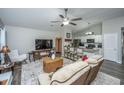 Bright living room open to the kitchen with modern finishes, vaulted ceiling and hard surface floors at 717 Temple Road # B, Ladson, SC 29456