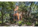 Two-story home with charming architectural details, including a quaint covered balcony at 82 Ponsbury Rd, Mount Pleasant, SC 29464