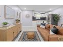 Cozy living area with plush sofa, modern decor, and seamless flow to kitchen at 867 Colony Dr # F92, Charleston, SC 29407