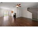 Living area featuring hardwood floors, a ceiling fan, and open access to the kitchen at 8987 Planters Row Ln, Summerville, SC 29485