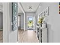 Welcoming entryway with light wood flooring, decorative accents, and ample natural light at 9009 Chato Ct, Summerville, SC 29483