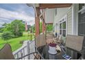 Relaxing outdoor porch with comfortable seating, perfect for enjoying the surrounding views at 1064 Blackbear Dr, Edisto Island, SC 29438