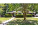 Charming brick home with a manicured lawn, mature shade trees, and a welcoming front entrance at 113 Overhill Dr, Walterboro, SC 29488