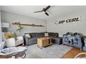 Cozy living room featuring a comfortable sectional sofa, ceiling fan, and stylish decor at 1160 Landsdowne Dr, Charleston, SC 29412