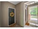 Welcoming entryway with a dark door, decorative wreath, and doormat at 1335 Hopton Cir # 1335, Mount Pleasant, SC 29466