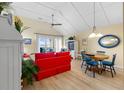 Cozy living room with vaulted ceilings and views of the ocean from the sliding door at 1376 Pelican Watch Villas, Seabrook Island, SC 29455