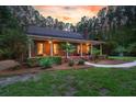 Inviting single-story home with a covered front porch and classic architectural design at 152 Candace Dr, Ridgeville, SC 29472