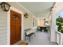 Inviting front porch with seating area and stylish light fixtures, perfect for relaxing at 158 Darlington Ave, Charleston, SC 29403