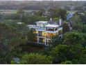 Beautiful multi-story home nestled among trees, featuring multiple balconies and rooftop deck at 2213 Rolling Dune Rd, Seabrook Island, SC 29455