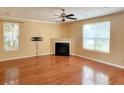 Inviting living room with a cozy fireplace, hardwood floors, and natural light at 3632 Locklear Ln, Mount Pleasant, SC 29466
