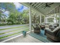 Relaxing front porch with comfortable seating and serene views at 7935 Flagship Ln, Johns Island, SC 29455