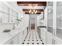 Modern galley kitchen featuring marble countertops, stainless steel appliances, and ample cabinet space at 80 Smith St, Charleston, SC 29401
