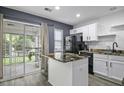 Well-lit kitchen with updated appliances and granite countertops at 8096 Shadow Oak Dr Dr, North Charleston, SC 29406