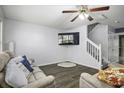 Cozy living room with hardwood floors and a ceiling fan at 8096 Shadow Oak Dr Dr, North Charleston, SC 29406
