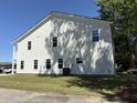 View of the rear exterior of the home showing siding and windows at 819 Burger St, Charleston, SC 29407
