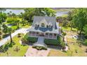 Aerial view of the charming house with a picturesque landscape and stunning water view at 8970 Palmetto Rd, Edisto Island, SC 29438