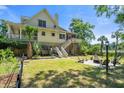 Well-maintained backyard featuring a patio with an outdoor seating area and a beautiful view at 8970 Palmetto Rd, Edisto Island, SC 29438