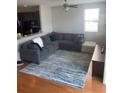 Cozy living room featuring a comfortable sectional sofa and area rug at 9217 Southern Oak Ln, Ladson, SC 29456